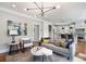 Bright living room with neutral tones, hardwood floors, and a view into the modern kitchen at 415 Fayetteville Rd, Decatur, GA 30030