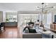 Cozy living room with hardwood floors, fireplace, and seamless transition to the dining area at 415 Fayetteville Rd, Decatur, GA 30030