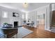 Bright living room with hardwood floors, fireplace, and views to the dining room and stairway at 415 Fayetteville Rd, Decatur, GA 30030