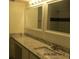 Bathroom vanity with granite countertops and large mirrors at 4263 Parkview Ct, Stone Mountain, GA 30083