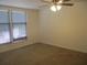 Bedroom featuring two bright windows and ceiling fan at 4263 Parkview Ct, Stone Mountain, GA 30083