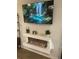 Cozy living room featuring a modern electric fireplace and large screen TV for relaxation and entertainment at 744 Great Oak Pl, Villa Rica, GA 30180