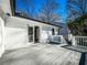 Exterior view of the expansive wooden back porch and white brick exterior at 1238 Westboro Sw Dr, Atlanta, GA 30310