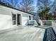 Exterior view of the expansive wooden back porch and white brick exterior at 1238 Westboro Sw Dr, Atlanta, GA 30310