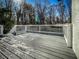 Exterior view of the expansive wooden back porch with white railings at 1238 Westboro Sw Dr, Atlanta, GA 30310