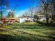 Backyard view of the home with a small white deck and a sloped lawn at 1238 Westboro Sw Dr, Atlanta, GA 30310