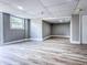 Finished basement features light gray walls, white trim, gray wood flooring, and outside access at 1238 Westboro Sw Dr, Atlanta, GA 30310