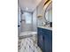 Contemporary bathroom featuring a blue vanity and a tiled shower at 1238 Westboro Sw Dr, Atlanta, GA 30310