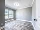 Cozy bedroom with wood paneled walls, recessed lighting, and new flooring creating a serene atmosphere at 1238 Westboro Sw Dr, Atlanta, GA 30310