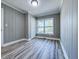 Comfortable bedroom featuring wood paneled walls, recessed lighting, and modern flooring for a relaxing space at 1238 Westboro Sw Dr, Atlanta, GA 30310