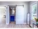 Light-filled bedroom showcasing barn door to the bath, complemented by contemporary decor at 1238 Westboro Sw Dr, Atlanta, GA 30310