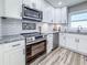 Beautiful kitchen with stainless steel appliances, subway tile backsplash, and granite countertops at 1238 Westboro Sw Dr, Atlanta, GA 30310