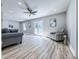 Open living area with modern ceiling fan, recessed lights and glass doors to the outdoor deck at 1238 Westboro Sw Dr, Atlanta, GA 30310