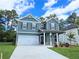 Charming two-story home with a two-car garage and well-maintained lawn at 2704 Mourning Dove Dr Lot 34, Grayson, GA 30017