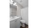 The bathroom features a single sink vanity, mirror, toilet and shower with a white curtain at 3645 Fay Dr, Rex, GA 30273