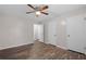 This bedroom features hardwood floors, a ceiling fan, and two doors at 3645 Fay Dr, Rex, GA 30273