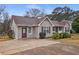 Charming single-story home with gray siding and a well-manicured front yard and drive at 3645 Fay Dr, Rex, GA 30273