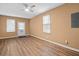 Living room with natural light, vinyl flooring, a ceiling fan, and a white entry door at 3645 Fay Dr, Rex, GA 30273