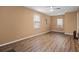 Spacious living room offers natural light and vinyl wood-look flooring at 3645 Fay Dr, Rex, GA 30273