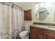 Bathroom featuring a granite vanity, toilet, and shower with decorative curtain at 45 Somerset Ct, Covington, GA 30016