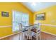 Cozy dining area with natural light, hardwood flooring and comfortable seating at 45 Somerset Ct, Covington, GA 30016