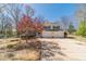 Inviting two-story home with blue shutters and a two-car garage, enhanced by landscaping at 45 Somerset Ct, Covington, GA 30016