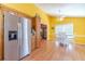 Kitchen with stainless steel refrigerator, breakfast area, and hardwood floors at 45 Somerset Ct, Covington, GA 30016