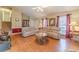 Bright living room with hardwood floors, a ceiling fan and comfortable seating at 45 Somerset Ct, Covington, GA 30016