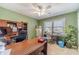 Spacious home office with green walls and carpet at 45 Somerset Ct, Covington, GA 30016