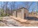 Spacious outbuilding with dual roll-up doors, providing ample storage or workshop potential on the property at 45 Somerset Ct, Covington, GA 30016