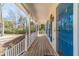 Inviting front porch with a blue door and matching shutters, offering a warm welcome at 45 Somerset Ct, Covington, GA 30016