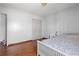Bright bedroom with hardwood floors, a closet, and a window at 1312 Brandl Sw Dr, Marietta, GA 30008