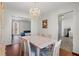 Cozy dining room with wooden floors, modern chandelier, and open access to the living room at 1312 Brandl Sw Dr, Marietta, GA 30008