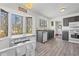 Bright kitchen with tile floors, large windows, gray cabinets, and stainless steel appliances at 1312 Brandl Sw Dr, Marietta, GA 30008