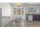 View of kitchen features an eat-in area with a bay window overlooking trees and a sink at 1312 Brandl Sw Dr, Marietta, GA 30008