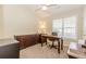 Bedroom or office with neutral decor and window overlooking the yard at 775 Freeman Dr, Covington, GA 30016
