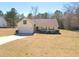 Charming single-story home boasts a well-maintained yard and attached two car garage at 775 Freeman Dr, Covington, GA 30016