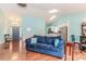 Sun-filled living room featuring hardwood floors, modern lighting and neutral paint palette at 775 Freeman Dr, Covington, GA 30016