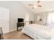 Light-filled main bedroom boasts carpet floors, a fan, and plenty of closet space at 775 Freeman Dr, Covington, GA 30016