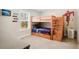 bedroom features a wooden bunk bed with built-in storage and a fun Flash wall decoration at 844 Pool Rd, Hiram, GA 30141