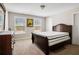 Bedroom with a comfortable mattress and a large dresser next to a window with a neighborhood view at 844 Pool Rd, Hiram, GA 30141