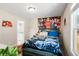 Bedroom featuring a large bed, anime wall mural, and an ensuite bathroom at 844 Pool Rd, Hiram, GA 30141