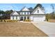 Charming two-story home with manicured landscaping and a welcoming front porch, perfect for enjoying the outdoors at 844 Pool Rd, Hiram, GA 30141