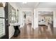 Elegant foyer featuring gleaming hardwood floors, stylish decor, and an open view to the living spaces at 844 Pool Rd, Hiram, GA 30141