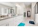 Main bathroom with double vanity, modern lighting, and a glass-enclosed shower at 844 Pool Rd, Hiram, GA 30141