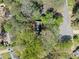 Aerial view of the property surrounded by mature trees and a quiet neighborhood at 985 Lake Haven Ct, Roswell, GA 30076
