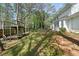 Lush backyard featuring a playhouse, green lawn, and a glimpse of the home's exterior at 985 Lake Haven Ct, Roswell, GA 30076