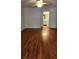 Bedroom view showcasing hardwood floors, ceiling fan and a connected bathroom at 985 Lake Haven Ct, Roswell, GA 30076