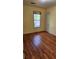 Cozy bedroom with natural light, hardwood floors, and a neutral color scheme at 985 Lake Haven Ct, Roswell, GA 30076