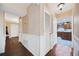 Hallway boasts hardwood floors, decorative molding, and access to various rooms in the home at 985 Lake Haven Ct, Roswell, GA 30076